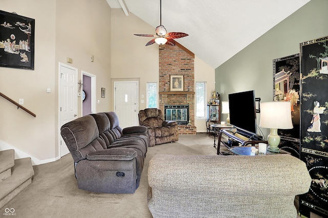 11620 E 75th St, Indianapolis, IN 46236 - carpeted living area with high vaulted ceiling, a ceiling fan, a brick fireplace, stairs, and baseboards
