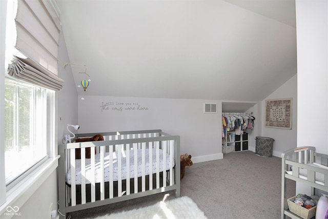825 Iowa St, Indianapolis, IN 46203 - carpeted bedroom featuring lofted ceiling, baseboards, a closet, and visible vents