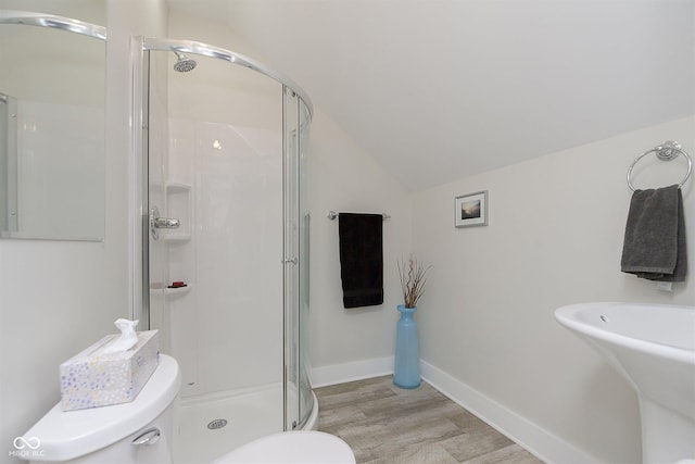 825 Iowa St, Indianapolis, IN 46203 - bathroom featuring lofted ceiling, a stall shower, toilet, baseboards, and wood finished floors