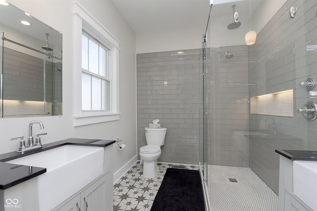 825 Iowa St, Indianapolis, IN 46203 - bathroom featuring recessed lighting, baseboards, toilet, a shower stall, and vanity