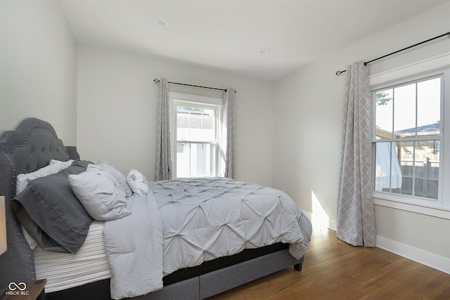 825 Iowa St, Indianapolis, IN 46203 - bedroom with baseboards and wood finished floors