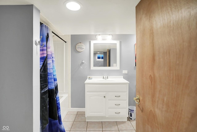 bathroom with tile patterned floors, baseboards, shower / bath combo, and vanity