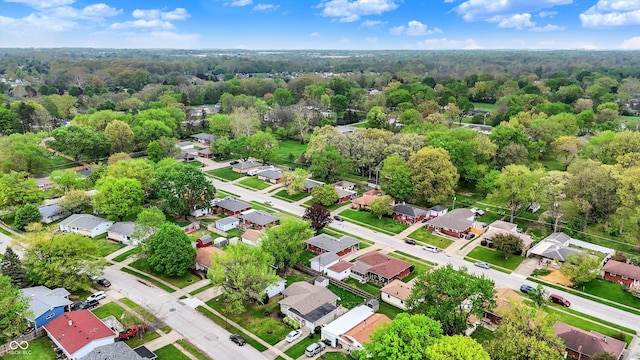drone / aerial view with a view of trees and a residential view