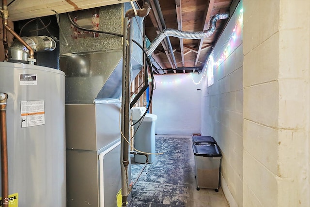 utility room featuring water heater