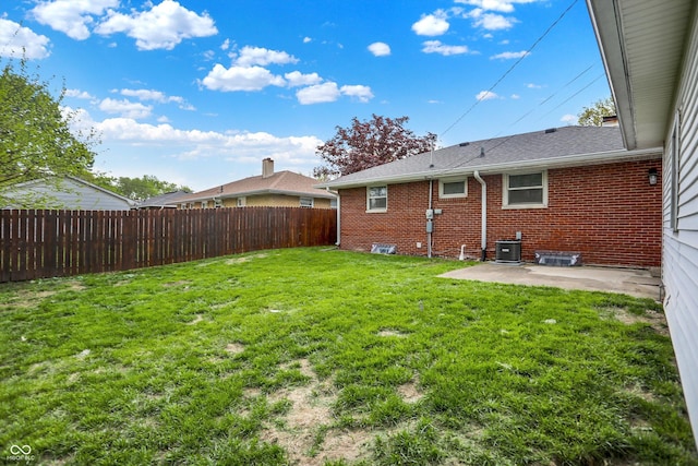 view of yard with a fenced backyard, a patio area, and central air condition unit