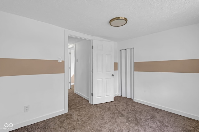 555 S Auburn St, Indianapolis, IN 46241 - unfurnished bedroom with carpet flooring, a textured ceiling, baseboards, and a closet
