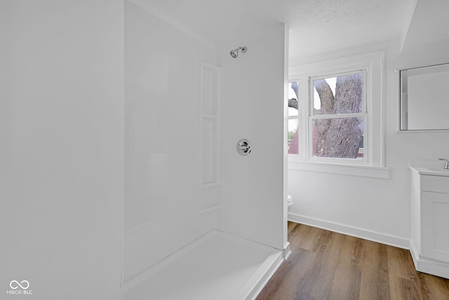 555 S Auburn St, Indianapolis, IN 46241 - interior space featuring baseboards, a textured ceiling, and wood finished floors