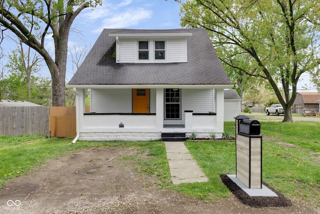 555 S Auburn St, Indianapolis, IN 46241 - bungalow-style home with a porch, a shingled roof, fence, and a front yard