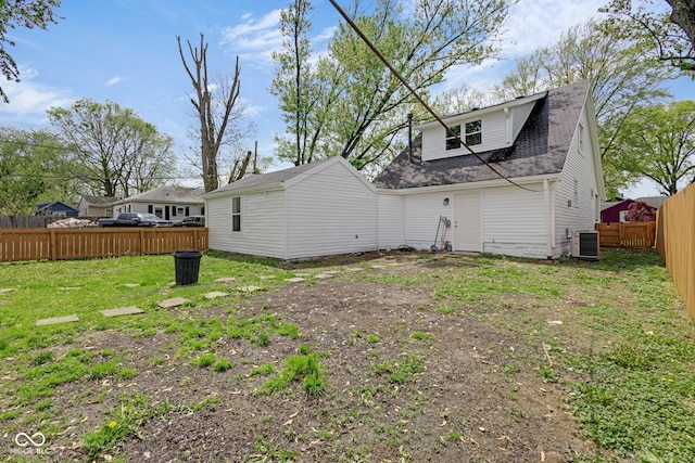555 S Auburn St, Indianapolis, IN 46241 - back of property with a fenced backyard, a shingled roof, and a lawn
