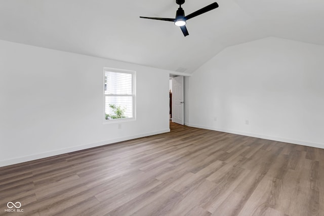 555 S Auburn St, Indianapolis, IN 46241 - empty room with a ceiling fan, baseboards, vaulted ceiling, and wood finished floors