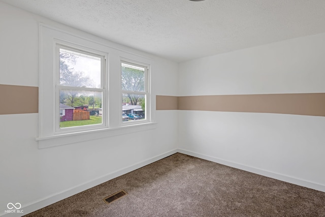 555 S Auburn St, Indianapolis, IN 46241 - carpeted spare room featuring visible vents, a textured ceiling, and baseboards