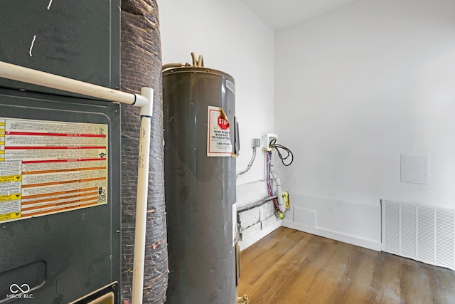 555 S Auburn St, Indianapolis, IN 46241 - utility room with water heater, heating unit, and visible vents