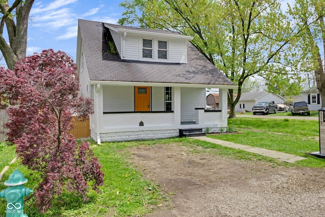 555 S Auburn St, Indianapolis, IN 46241 - bungalow-style home featuring a porch, a shingled roof, and a front yard