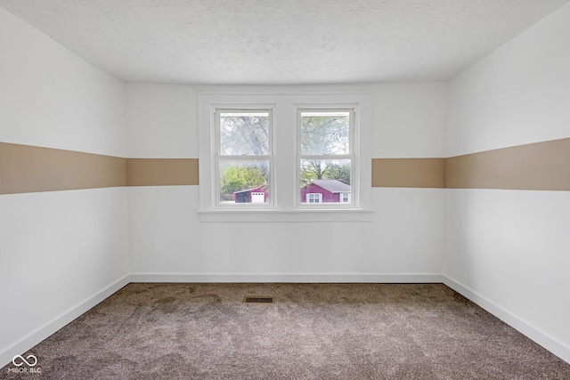 555 S Auburn St, Indianapolis, IN 46241 - carpeted empty room featuring baseboards, a textured ceiling, and visible vents