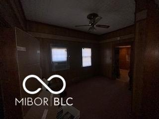 unfurnished room featuring ceiling fan