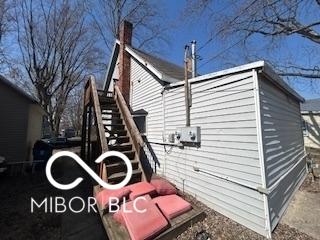view of home's exterior featuring stairs