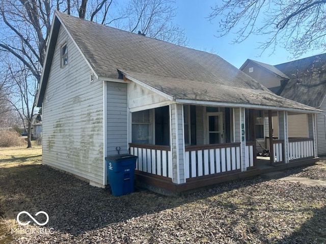 view of side of home with a porch