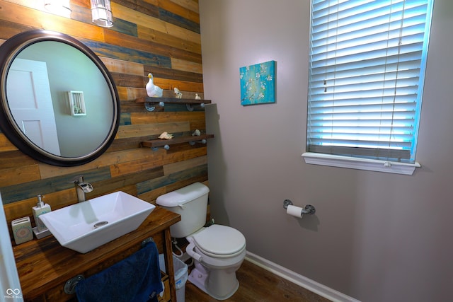 9993 Pepper Tree Ln, Noblesville, IN 46060 - half bathroom featuring wooden walls, baseboards, vanity, and toilet