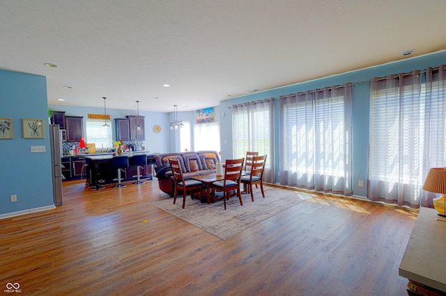 9993 Pepper Tree Ln, Noblesville, IN 46060 - dining room featuring baseboards, recessed lighting, and wood finished floors