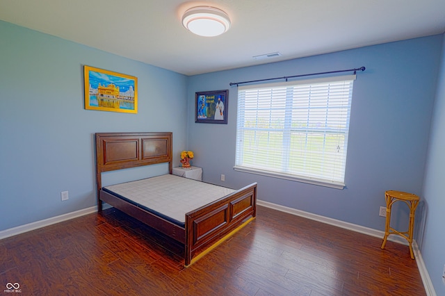 9993 Pepper Tree Ln, Noblesville, IN 46060 - bedroom with baseboards, wood finished floors, and visible vents