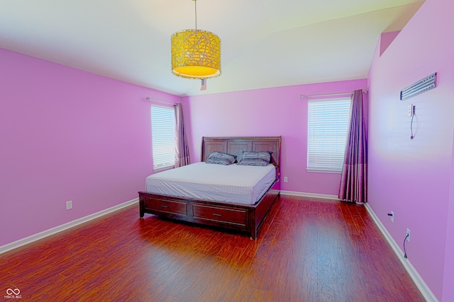 9993 Pepper Tree Ln, Noblesville, IN 46060 - bedroom with baseboards, wood finished floors, and lofted ceiling