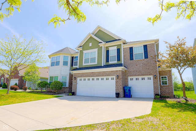 9993 Pepper Tree Ln, Noblesville, IN 46060 - view of front facade with concrete driveway, brick siding, a front yard, and a garage
