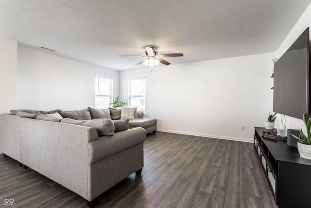6559 Ambrosia Ln, Pendleton, IN 46064 - living room with baseboards, a ceiling fan, dark wood-style flooring, and a textured ceiling