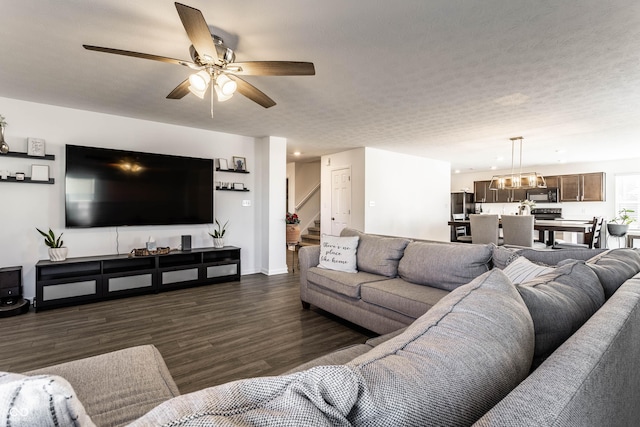 6559 Ambrosia Ln, Pendleton, IN 46064 - living area with stairs, dark wood-style flooring, a ceiling fan, and baseboards