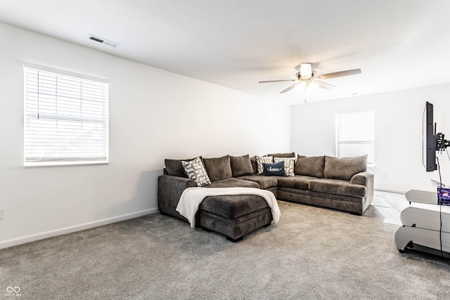6559 Ambrosia Ln, Pendleton, IN 46064 - carpeted living room with visible vents, a ceiling fan, baseboards, and a healthy amount of sunlight