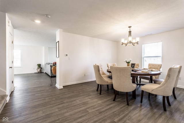 6559 Ambrosia Ln, Pendleton, IN 46064 - dining space featuring baseboards, dark wood-style flooring, and a notable chandelier