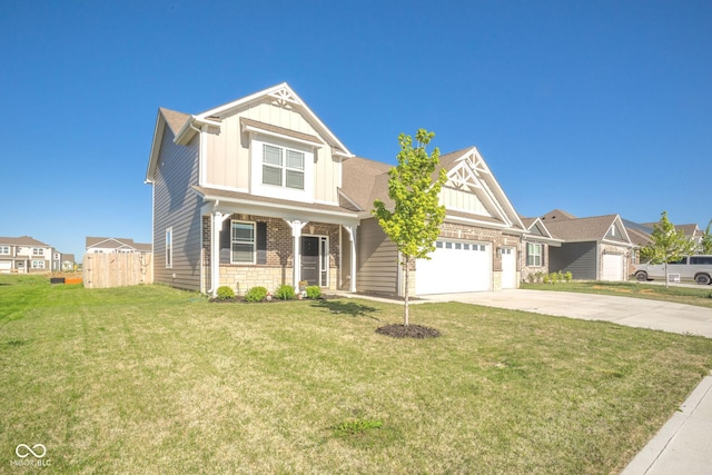 657 Kilmore Dr, Pendleton, IN 46064 - view of front of home with concrete driveway, board and batten siding, a garage, and a front yard