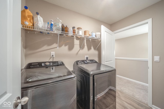 657 Kilmore Dr, Pendleton, IN 46064 - washroom with laundry area, independent washer and dryer, wood finished floors, and baseboards