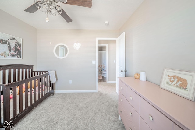 657 Kilmore Dr, Pendleton, IN 46064 - bedroom featuring a crib, baseboards, a ceiling fan, and light colored carpet