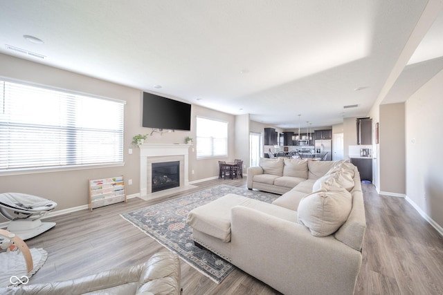 657 Kilmore Dr, Pendleton, IN 46064 - living room featuring baseboards, light wood-style flooring, and visible vents