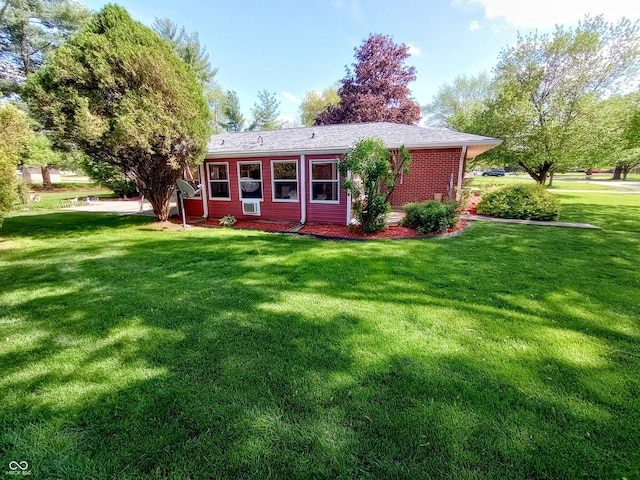 back of house with a yard
