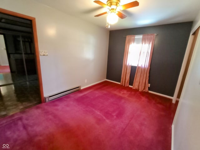 unfurnished room with baseboards, a ceiling fan, baseboard heating, and dark carpet