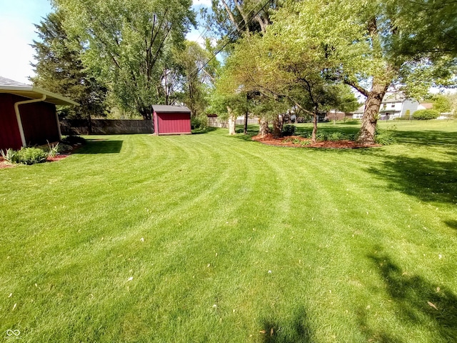view of yard with an outdoor structure and a storage unit