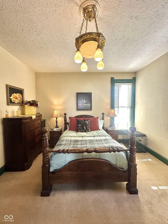 2119 S Garfield Dr, Indianapolis, IN 46203 - carpeted bedroom with baseboards and a textured ceiling