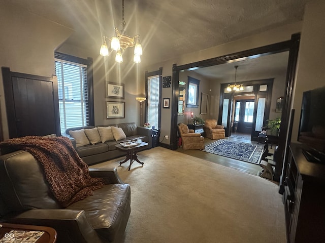 2119 S Garfield Dr, Indianapolis, IN 46203 - carpeted living room featuring a chandelier