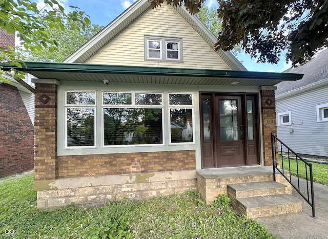 2119 S Garfield Dr, Indianapolis, IN 46203 - doorway to property featuring brick siding