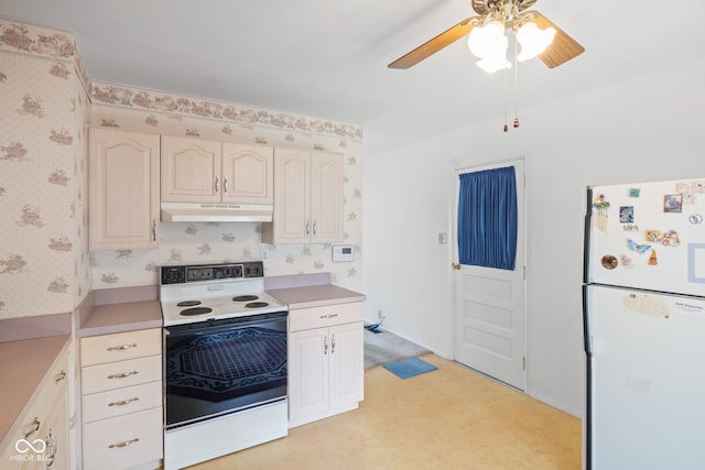 kitchen with ceiling fan, white appliances, light countertops, wallpapered walls, and under cabinet range hood