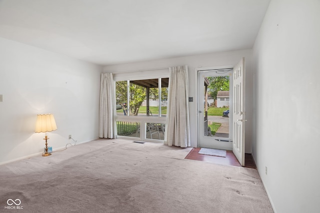 interior space with baseboards and plenty of natural light
