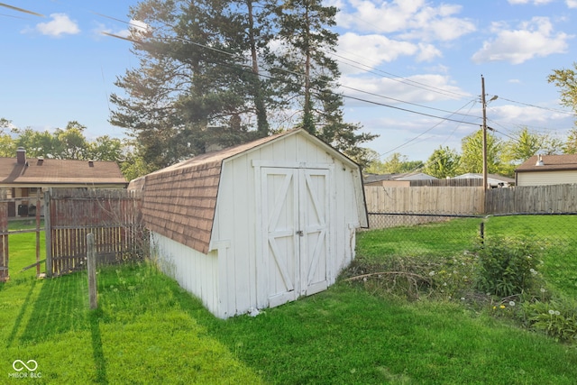 view of shed featuring a fenced backyard