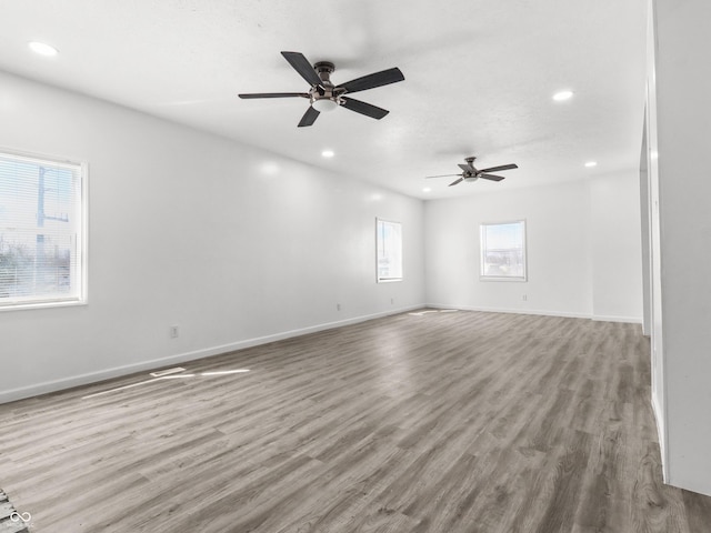 1630 N Granville Ave N, Muncie, IN 47303 - unfurnished room with baseboards, a ceiling fan, recessed lighting, and wood finished floors