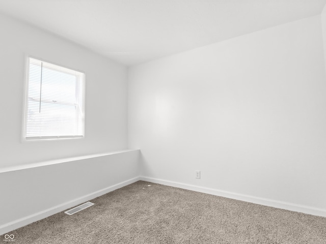 1630 N Granville Ave N, Muncie, IN 47303 - carpeted empty room with baseboards and visible vents