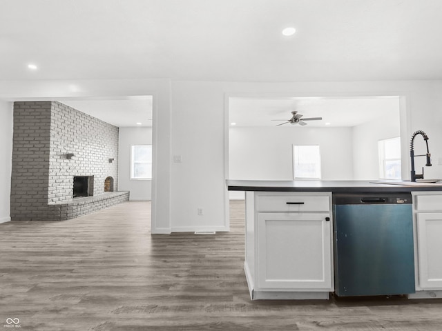 1630 N Granville Ave N, Muncie, IN 47303 - kitchen featuring a ceiling fan, dishwasher, a sink, white cabinets, and open floor plan