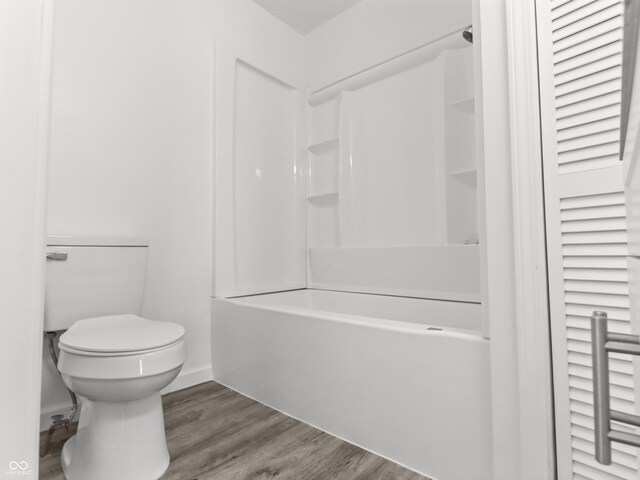 1630 N Granville Ave N, Muncie, IN 47303 - bathroom with baseboards, wood finished floors, and toilet