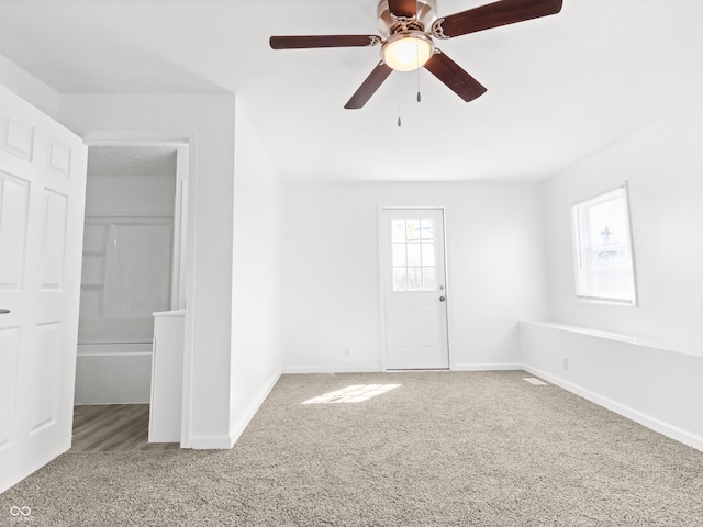 1630 N Granville Ave N, Muncie, IN 47303 - unfurnished bedroom featuring baseboards, ceiling fan, and carpet