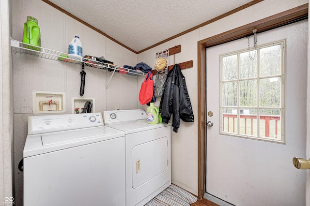 washroom featuring laundry area, ornamental molding, a textured ceiling, and independent washer and dryer