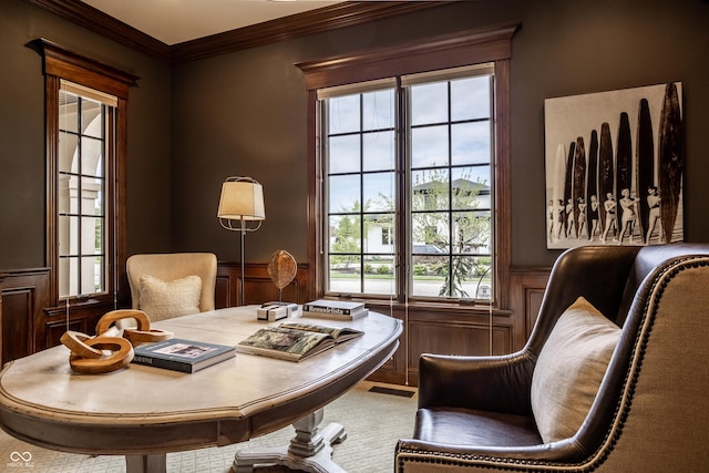 office area with crown molding and wainscoting